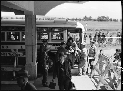 San Bruno, California. The last family off of the bus from San Francisco, have just arrived at this . . . - NARA - 537488