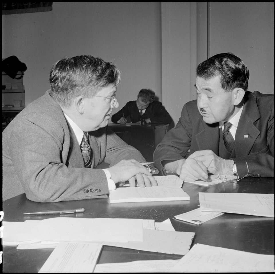San Francisco, California. A business man of Japanese ancestry confers with a representative of the . . . - NARA - 536054