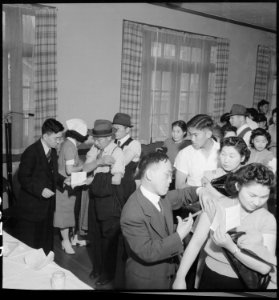 San Francisco, California. As a safeguard for health, evacuees of Japanese descent were inoculated . . . - NARA - 536393