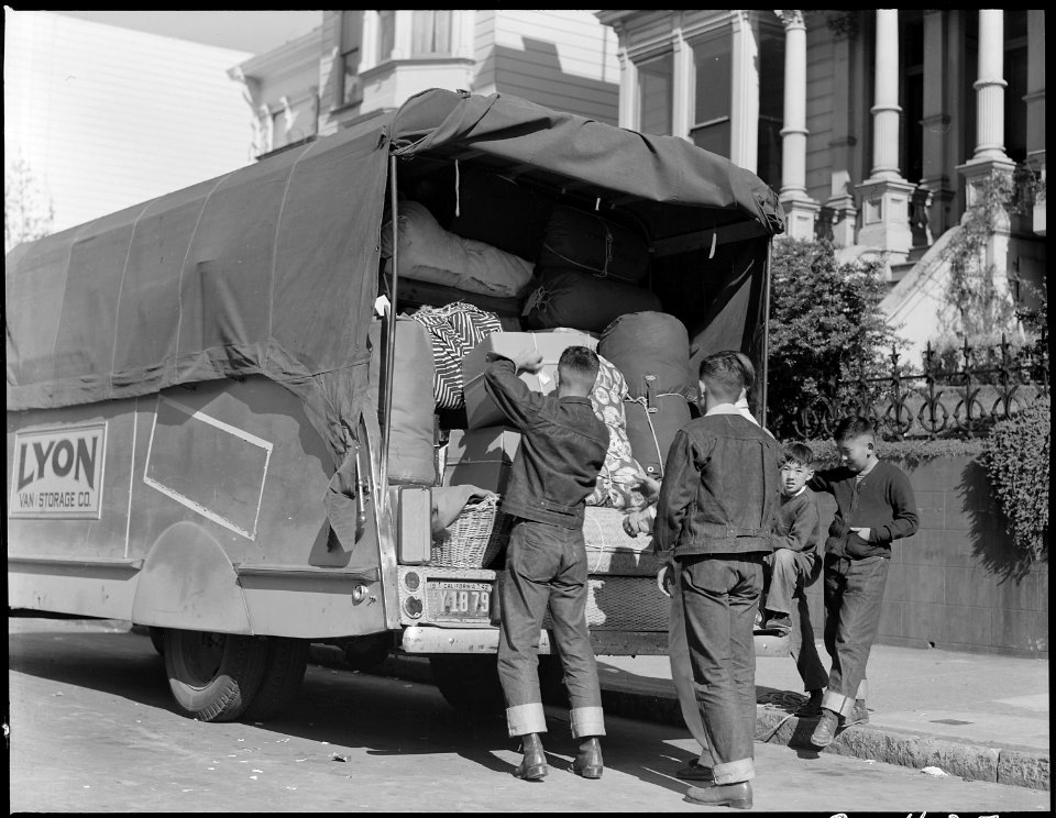 San Francisco, California. Boys of Japanese ancestry unloading bed-rolls and baggage, which they ha . . . - NARA - 537748