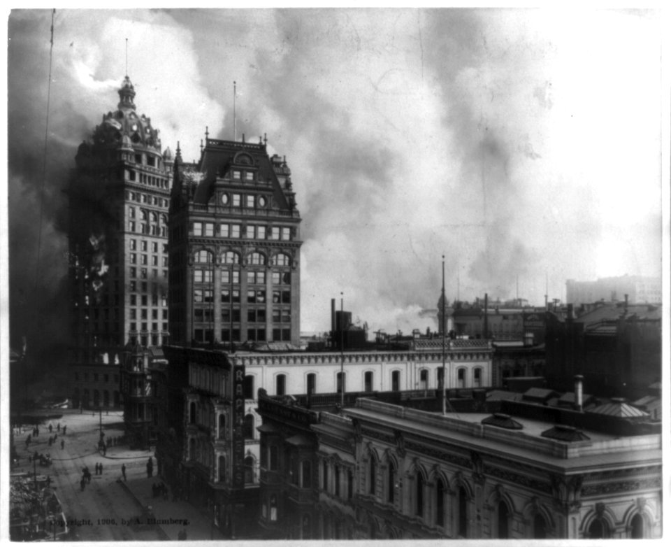 San Francisco disaster - earthquake and fire - several buildings in foreground, one large building on fire, other buildings and smoke in background LCCN2004680499
