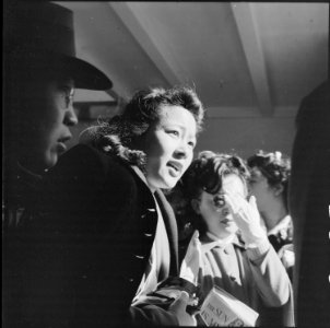 San Francisco, California. Girls of Japanese ancestry have just sighted a Greyhound bus which will . . . - NARA - 537689