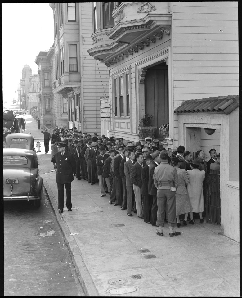 San Francisco, California. Lining up before Japanese American Citizens League auditorium at 2031 Bu . . . - NARA - 536461
