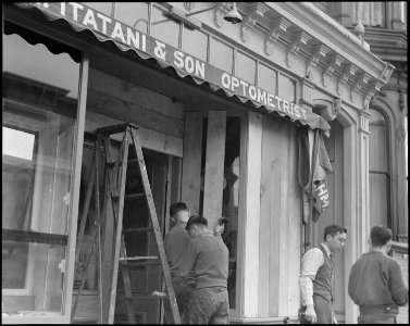 San Francisco, California. Owners of Japanese ancestry board windows of their stores on Post Street . . . - NARA - 536455 photo