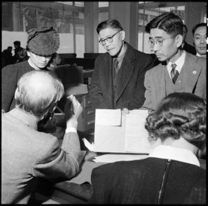 San Francisco, California. Residents of Japanese ancestry file forms containing personal data, two . . . - NARA - 536056 photo