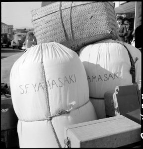 San Francisco, California. Bed roll and baggage of evacuees of Japanese ancestry awaiting shipment . . . - NARA - 537757 photo