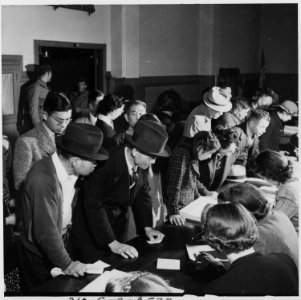 San Francisco, California. The residents of Japanese ancestry appear at 2031 Bush Street for inform . . . - NARA - 536463 photo