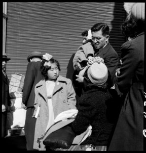 San Francisco, California. This family of Japanese ancestry are waiting for the evacuation buses wh . . . - NARA - 537754 photo