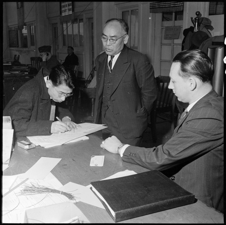 San Francisco, California. Father and son register for evacuation of persons of Japanese ancestry. . . . - NARA - 536055