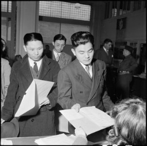 San Francisco, California. Residents of Japanese ancestry file forms containing personal data, two . . . - NARA - 536057 photo