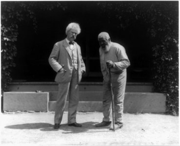 Samuel Clemens and John T. Lewis (an elderly African American man), both full length, standing LCCN2005680947