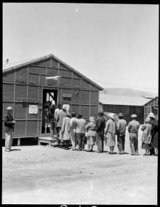 San Bruno, California. Here a line is seen waiting to enter the building where they will cast their . . . - NARA - 537914 photo