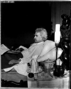 Samuel Langhorne Clemens, 1835-1910, half-length portrait, lying in bed, facing left LCCN2005691598