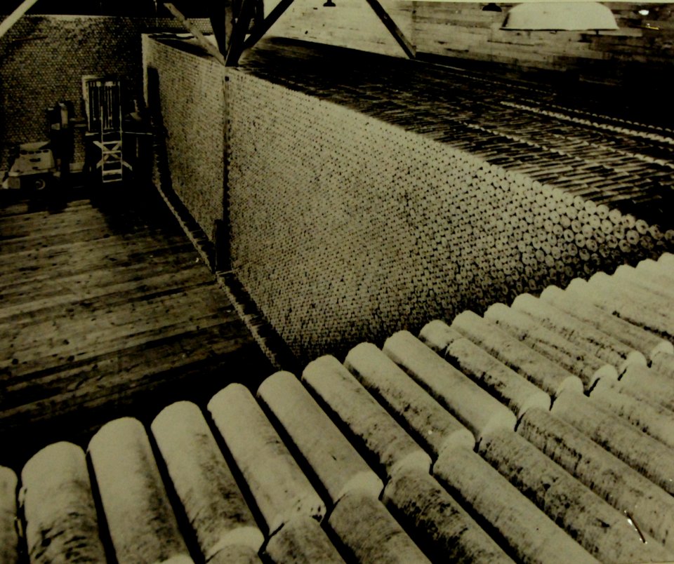 Sawdust heats American homes, sawdust logs in storage (23681690805)