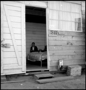 San Bruno, California. A close-up of an entrance of a family apartment. Note that the windows in t . . . - NARA - 537901