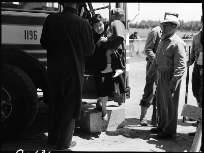 San Bruno, California. Arriving at the Assembly center, the man at the right is a volunteer Japanes . . . - NARA - 537483