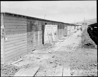 San Bruno, California. Shown here is one type of barracks for family use. These were formerly the . . . - NARA - 537949 photo