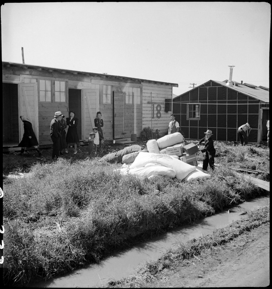 San Bruno, California. This assembly center has been open for two days. Bus- load after bus-load o . . . - NARA - 537676