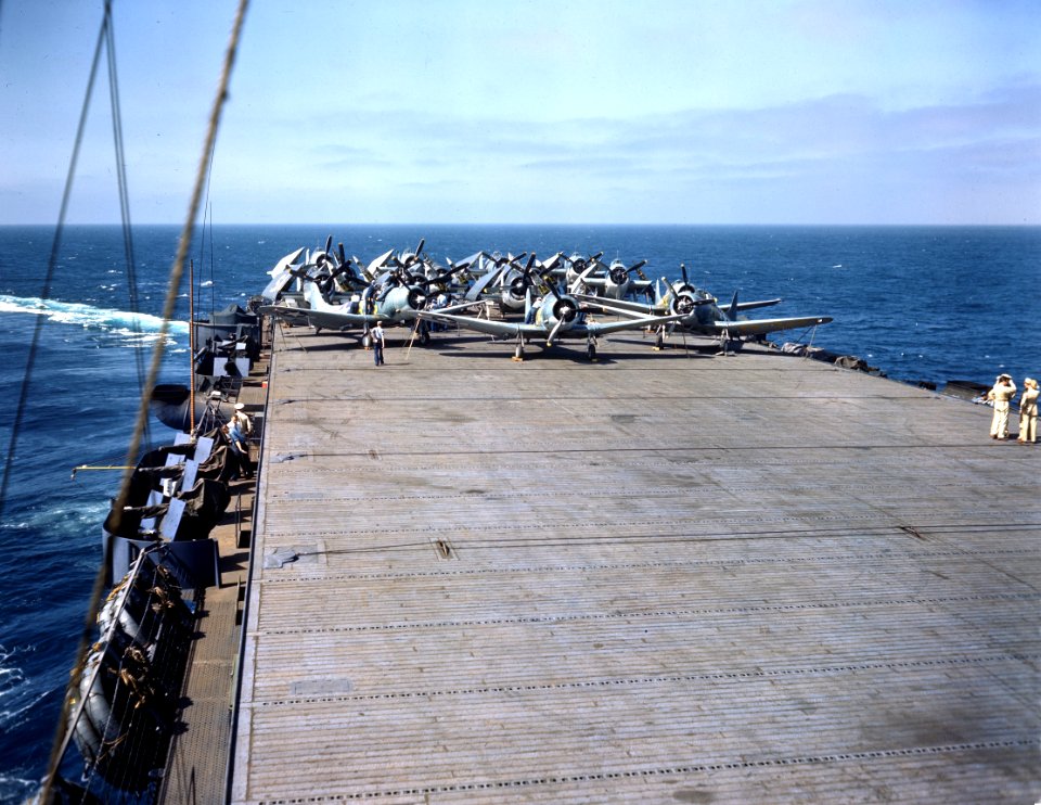 SBD, F6F and TBF aircraft are respotted for take off on a escort carrier c1943