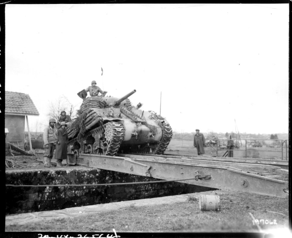 SC 177062 - A tank crosses a treadway bridge near Belfort, France, as the French drive to take this German strong point. November 20, 1944