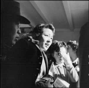 San Francisco, California. Girls of Japanese ancestry have just sighted a Greyhound bus which will . . . - NARA - 537689