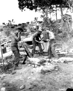 SC 206510 - Mortar crew of 7th Infantry Division load chemical mortar gun as they blast Jap positions impeding the advance into Okinawa