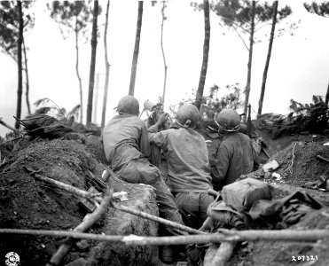 SC 207321 - Machine gun crew of the 1st Bn., 381st Infantry, keep on the alert for enemy movement on Okinawa. 19 April, 1945