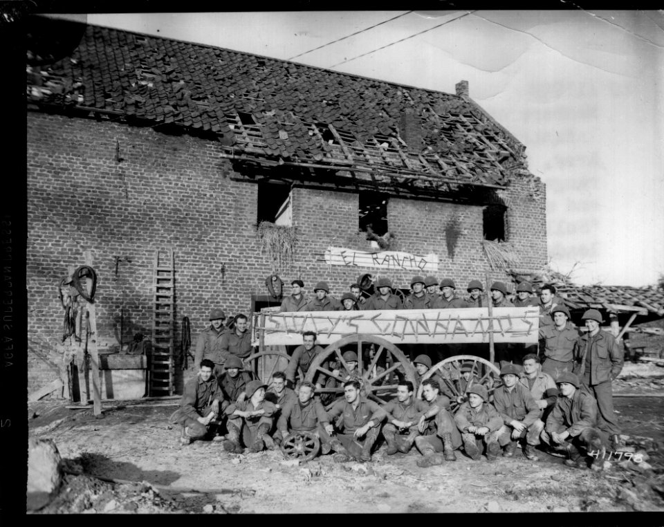 SC 411798 - Members of Company B, 1st Bn., 407th Regiment, 102nd Division, in front of their simulated western dude ranch