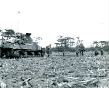 SC 204285 - Supported by a tank, infantrymen advance through heavy fire on the southern front on Okinawa island photo