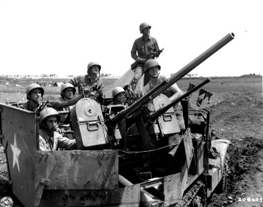 SC 208603 - An alert gun crew mans the lethal turret of this halftrack, on guard against Jap air attacks on Yontan airfield, Okinawa photo