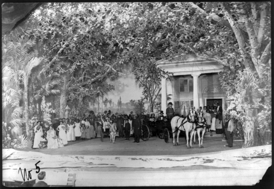 Scene from stage production of Uncle Tom's Cabin, 1901)- crowd scene in front of plantation house; Uncle Tom standing between girl in pony cart and couple in carriage LCCN2004681921