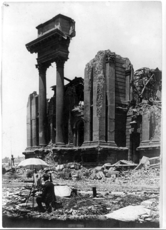 Scene painter amid earthquake rubble painting picture of ruins of large building after San Francisco earhtquake-fire. 1906 LCCN2003679673