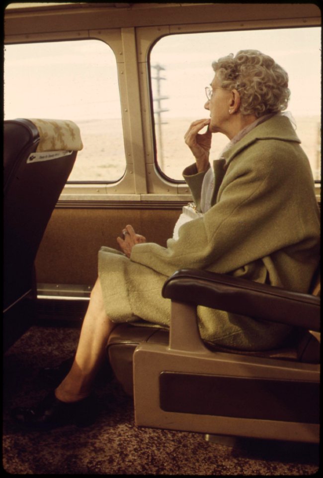 Scenery-on-the-southwest-limited-attracts-an-elderly-passenger-on-an-amtrak-train-between-los-angeles-california-and-albuquerque-new-mexico-june-1974 7158168570 o