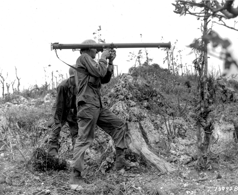 SC 139928 - Pfc. Alden A. Fisher, Morganton, Ga., fires a bazooka, Pfc. William Miller, Oceanside, Long Island, is the loader