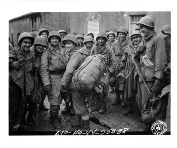 SC 196561 - Although these infantrymen are tired and wet, they are happy and the moral is high. Bult area, France, 11 November, 1944