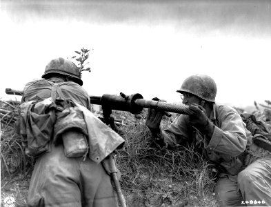 SC 208846 - A guncrew of the 383rd Inf. Regt. loads a shell into the new 57mm recoiless rifle to fire against Jap pillboxes and caves on Okinawa. 10 June, 1945 photo