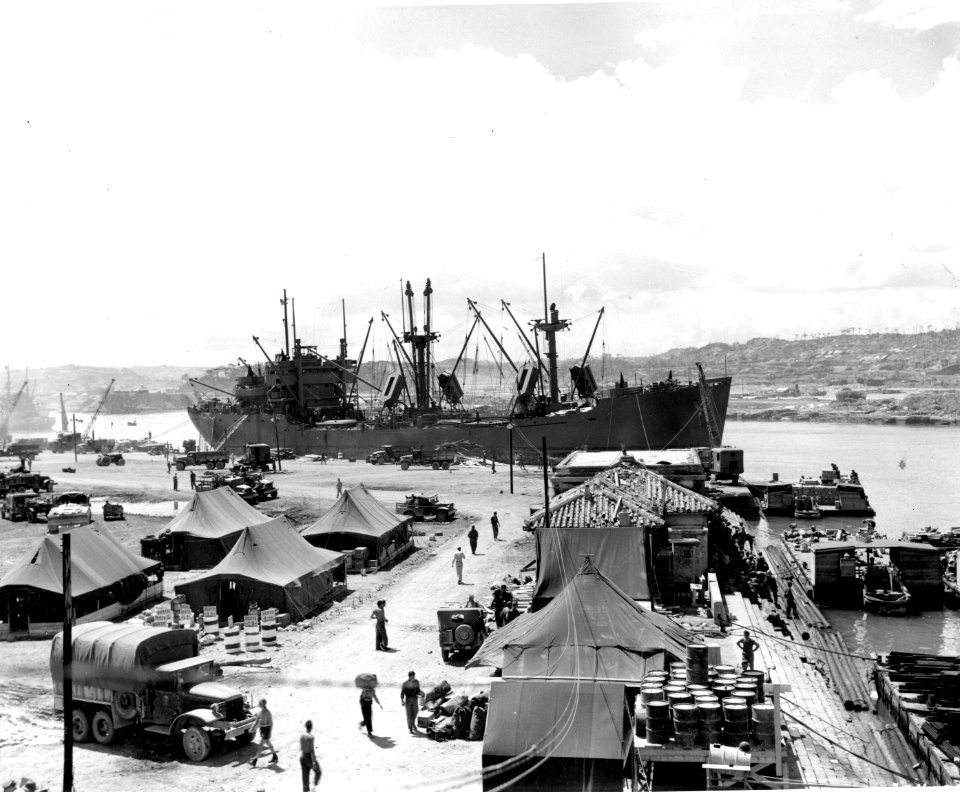 SC 204192 - The “Spar Hitch”, C1-M-AVI, captained by Carl, E. Peterson, New York, N.Y., in background, is the first big ship to enter Naha Harbor, Okinawa