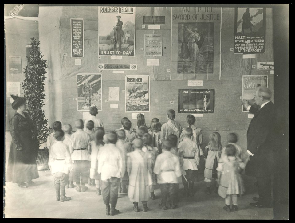 School children viewing an exhibition of English World War I posters, possibly in Russia LCCN2016652130