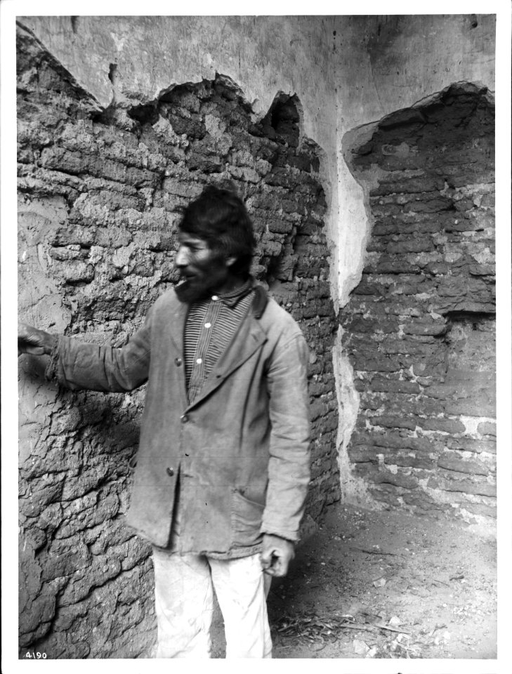 Sancristan at wall of Mission Tumacacori, Arizona, ca.1908 (CHS-4190)