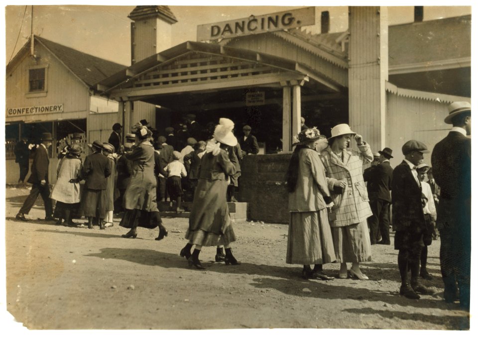 Sandy Beach. Two girls in foreground about 15. Mr. Tebbutt says dance hall bad conditions. Saturday evening dancing would be about the same as this. Penny picture machine attracting crowds. LOC nclc.05027