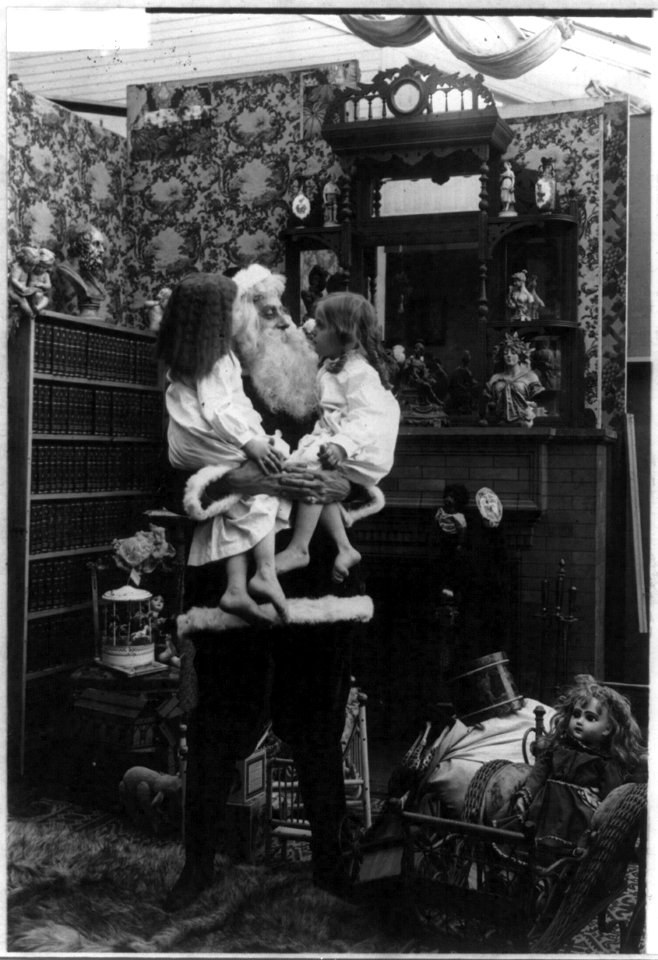 Santa Claus holding 2 children LCCN2003668067
