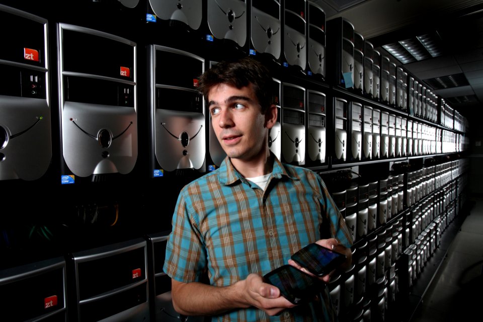 Sandia researcher holds two android smartphones