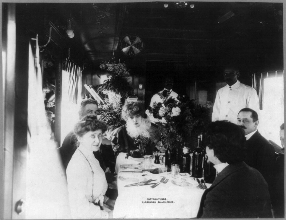 Sarah Bernhardt, 1844-1923, head and shoulders portrait, seated with others at dining table in her special railroad car, facing front, Dallas, Texas, Mar. 26, 1906 LCCN2005692237