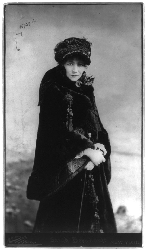 Sarah Bernhardt, 1844-1923, three-quarters length portrait, standing, facing slightly right; wearing fur coat LCCN2005683744
