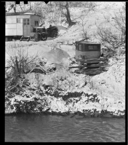 Scott's Run, West Virginia. Outdoor privy - Scene taken from the main highway. The stream is Scott's Run. This privy... - NARA - 518418 photo