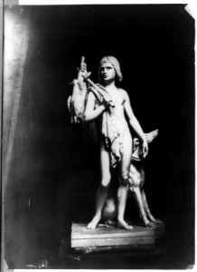Sculpture of boy with birds slung over his shoulder and dog LCCN2002717763