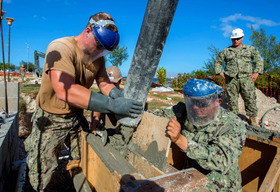 Seabee secures rebar at a work site for a restroom and shower facility. (24763805067)