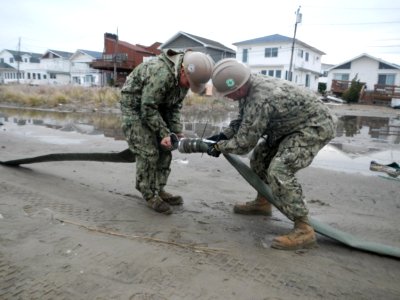 Seabees unhook a pipe after removing flood water. (8200230564)