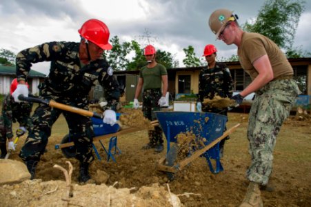 Seabees and Armed Forces of the Philippines engineers work on a community service project. (17075706586) photo