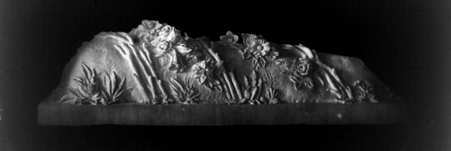 Sculpture of small mound with flowers LCCN2002717758